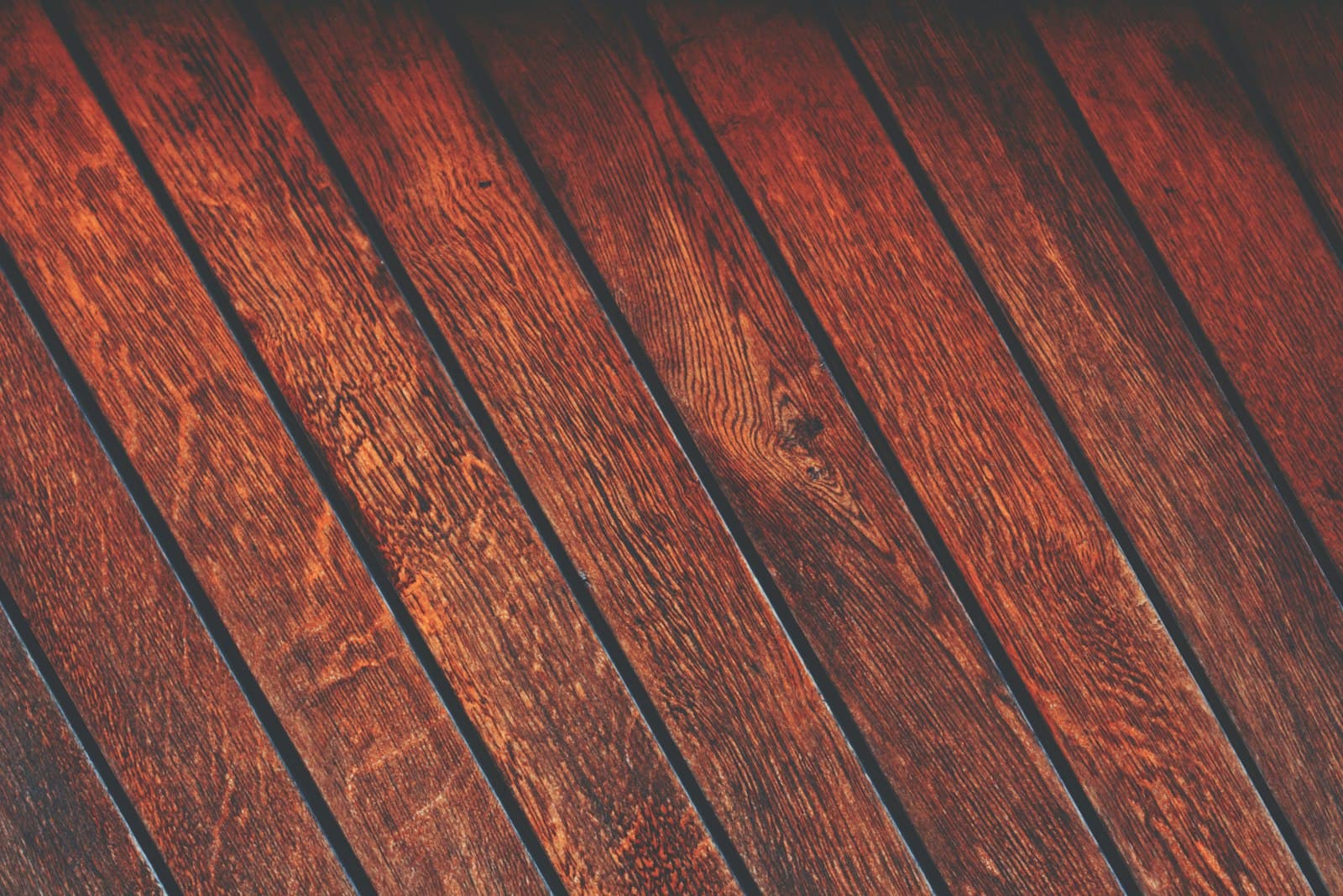 Close-up of a brown walnut parquet flooring surface