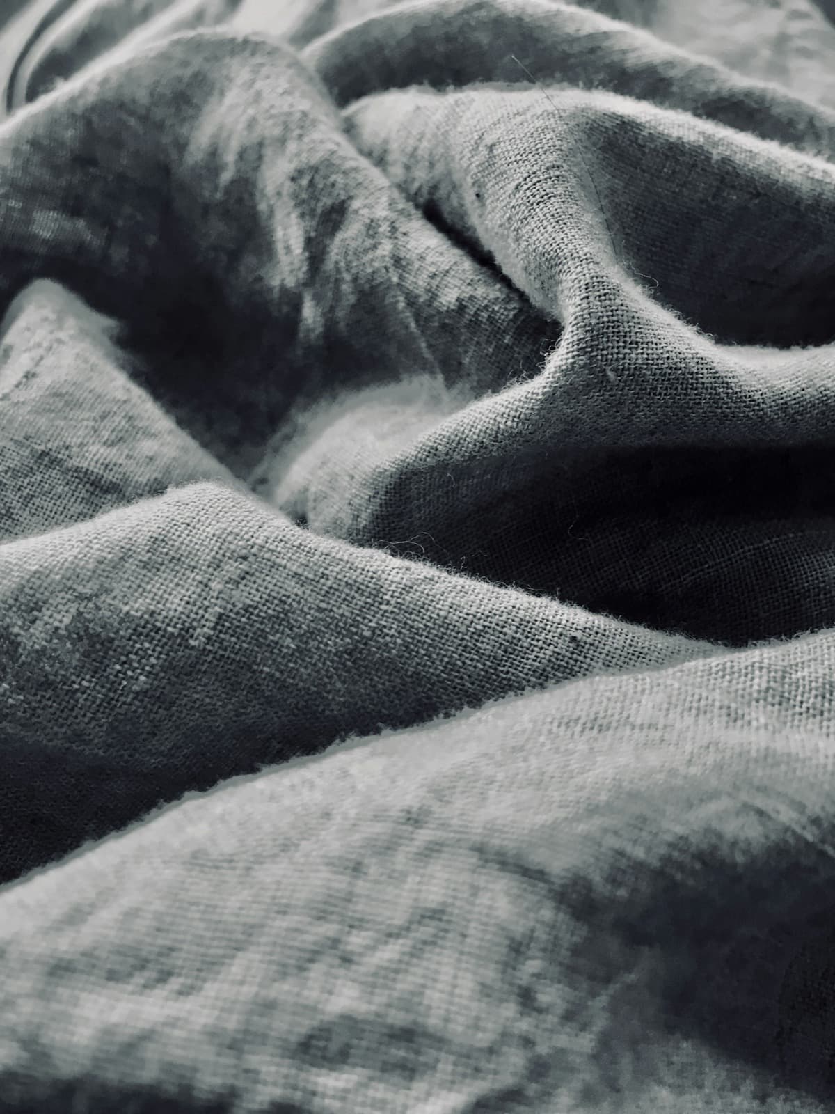 Close-up of a fine grey linen-weave wall covering