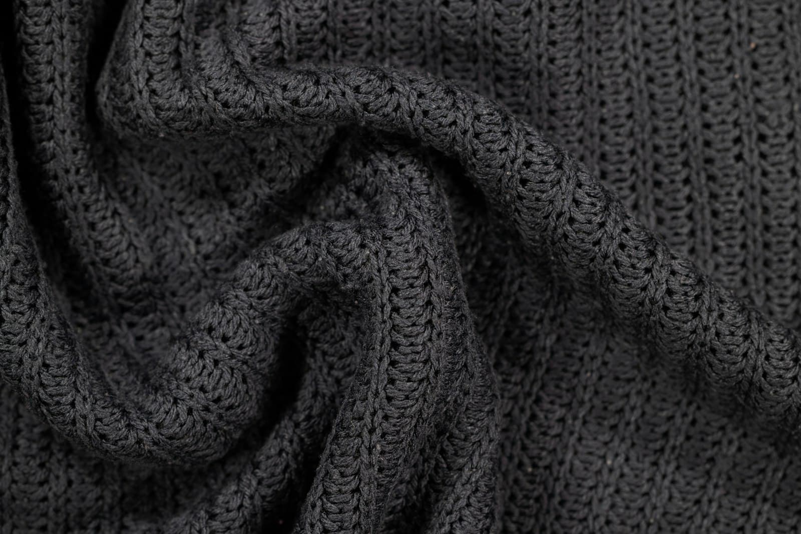 Close-up of a charcoal knitted fabric