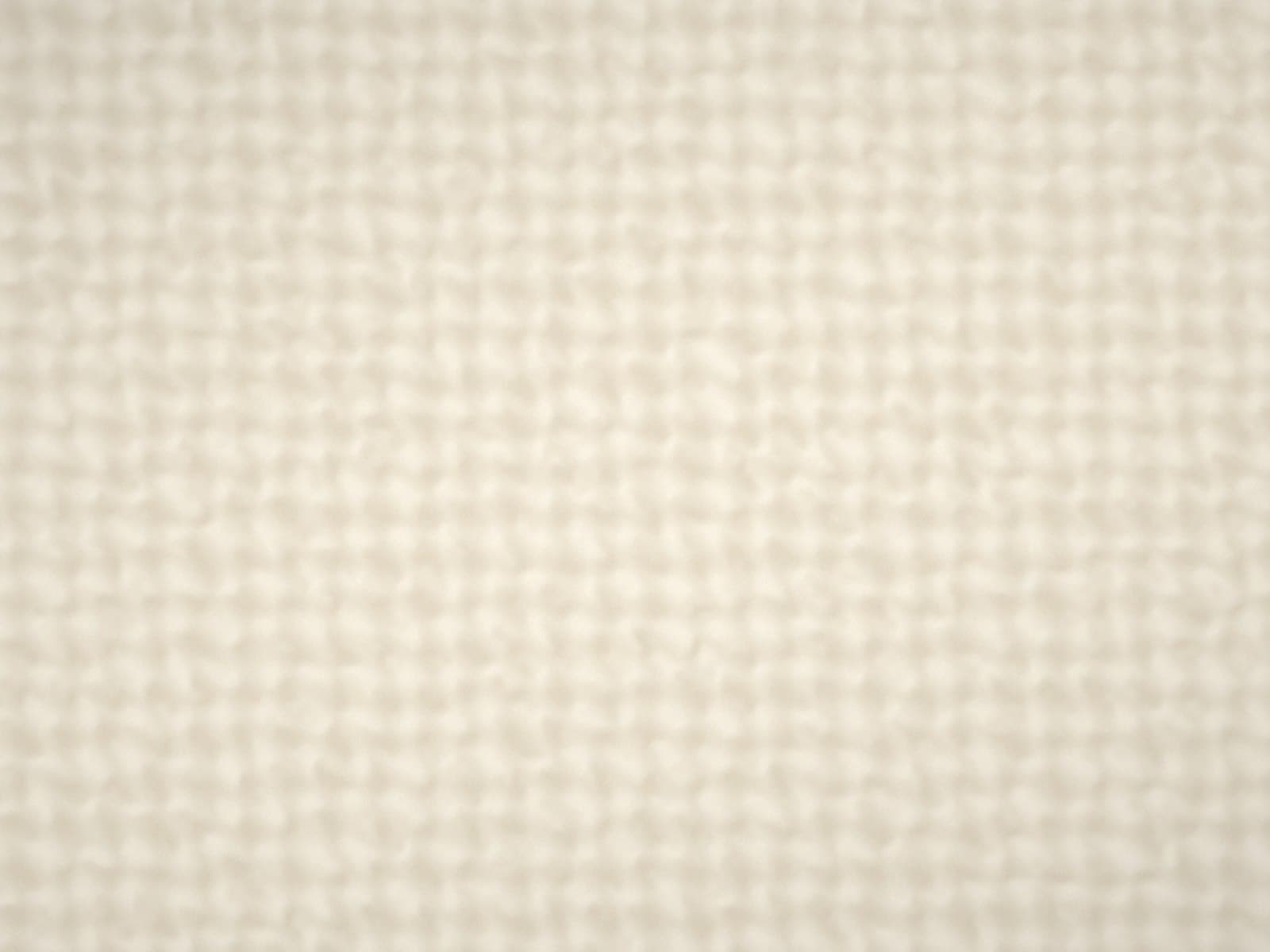 Close-up of a woven upholstery fabric in ivory