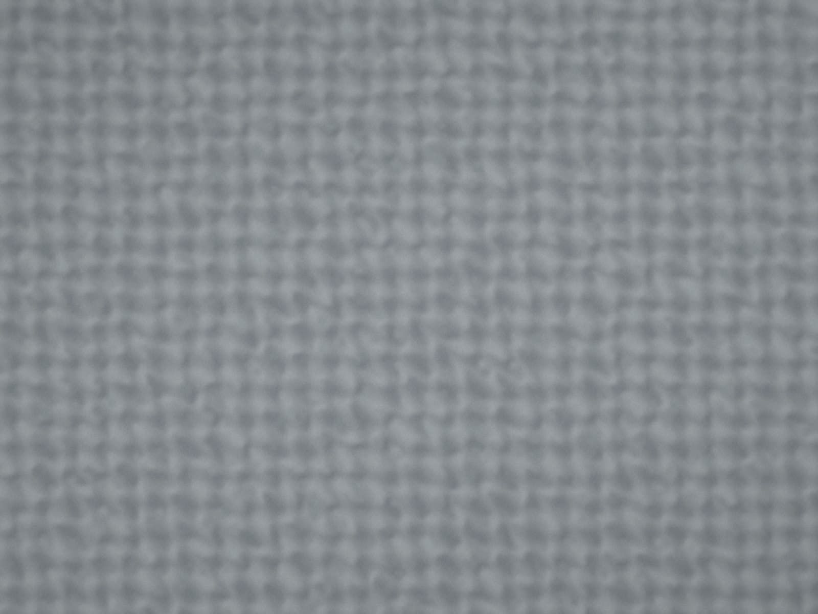 Close-up of a woven upholstery fabric in slate grey