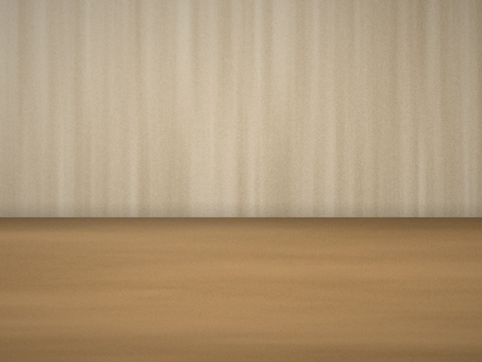 A natural fibre wall covering meeting an oak floor in a softly lit room corner