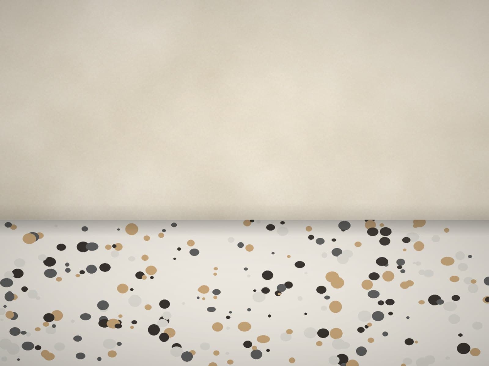 A plaster wall meeting a terrazzo floor in a softly lit room corner
