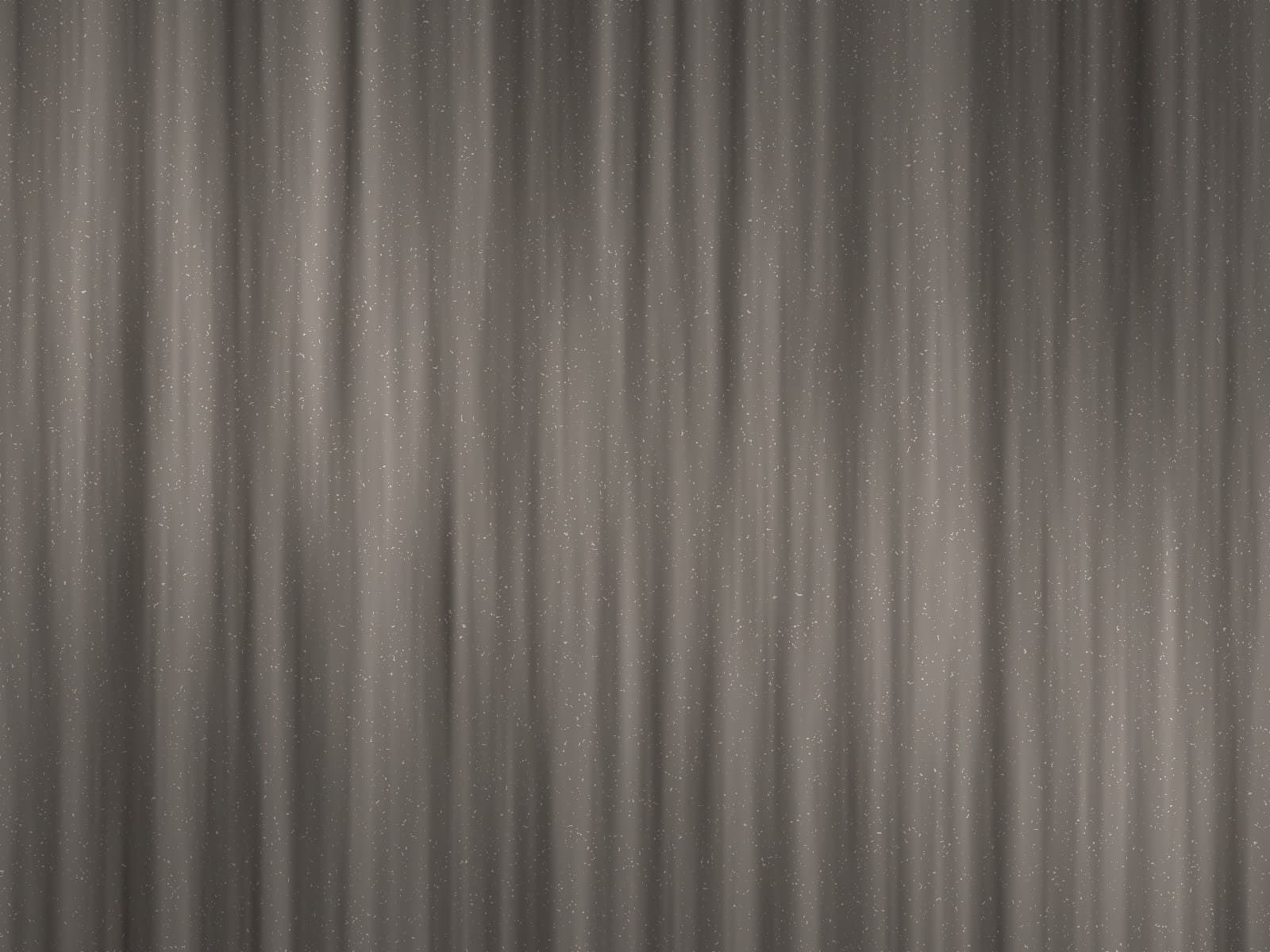 Close-up of a graphite-toned mica wall covering catching light