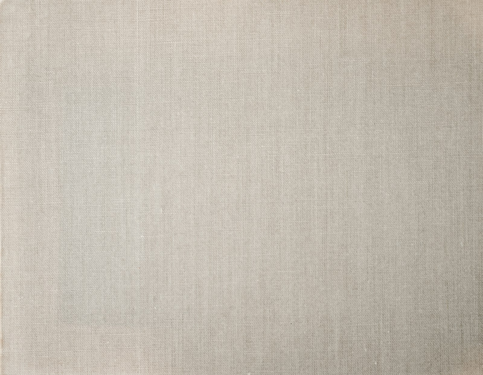 Close-up of a textured linen-effect wall covering in warm beige